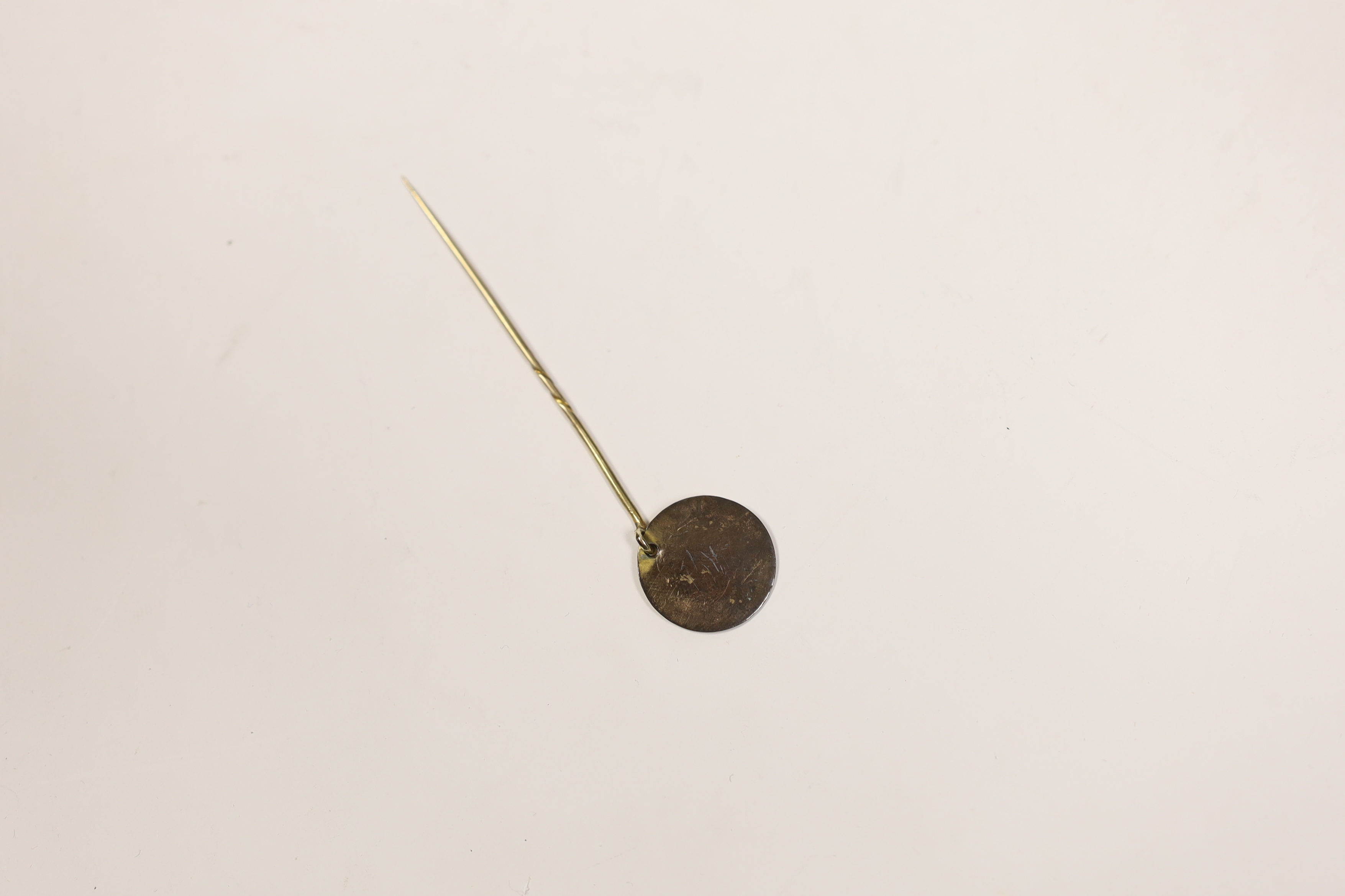 Yellow metal disc - a relic of the foundation piles to the Old London Bridge, 6.5cm in length